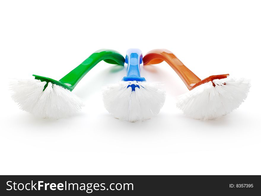 Three color cleaning brushes on white background. Three color cleaning brushes on white background