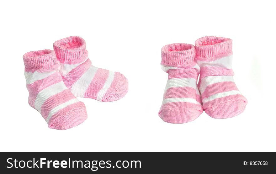 Pink babys socks on a white background. Pink babys socks on a white background