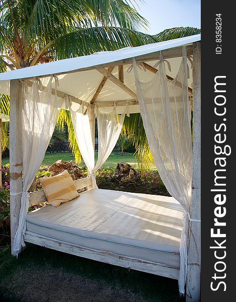 Tropical canopy bed in gardens. Tropical canopy bed in gardens