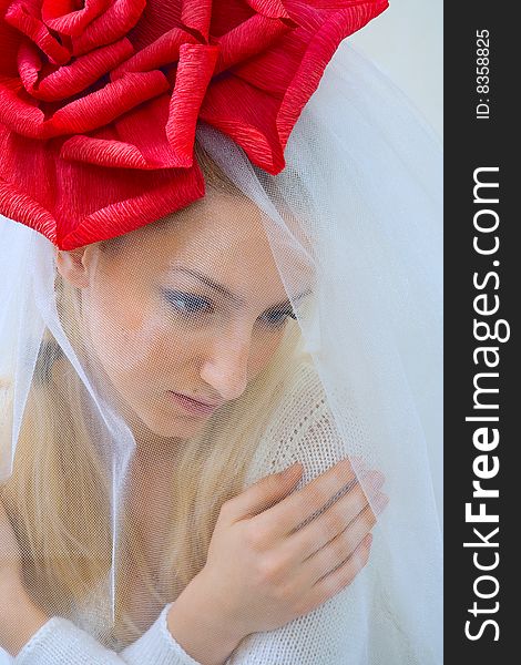 Young beautiful bride with a red bow on a head