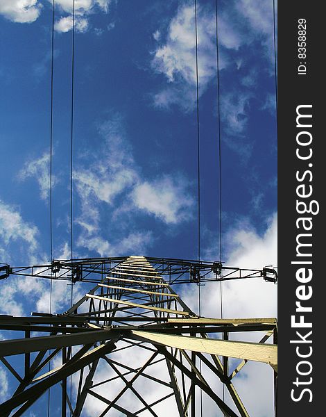 Old iron high-voltage pylon. Kind of electricity tower. Beautyfull sky in the background. Old iron high-voltage pylon. Kind of electricity tower. Beautyfull sky in the background.