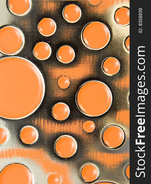 Background of orange textured metal with circles