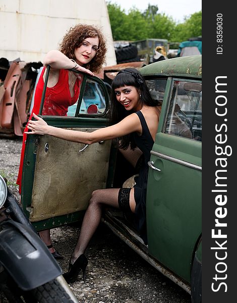 Two lovely girls with vintage car outdoors. Two lovely girls with vintage car outdoors