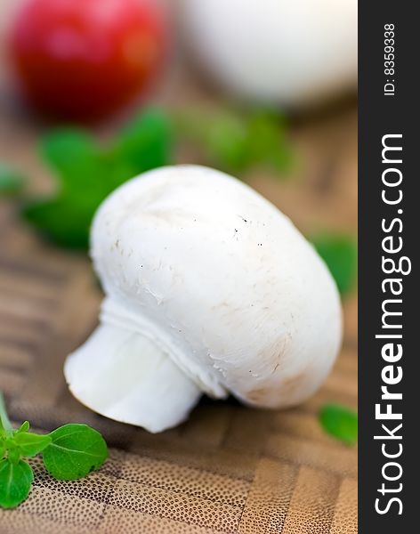 Fresh Mushrooms Isolated On A Wooden Background