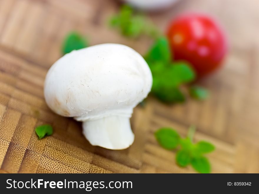 Fresh mushrooms isolated on a wooden background