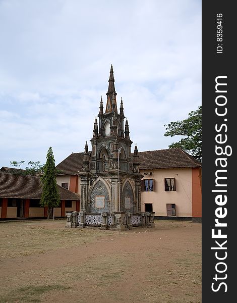 Indian temple in Kerala over blue sky with green trees