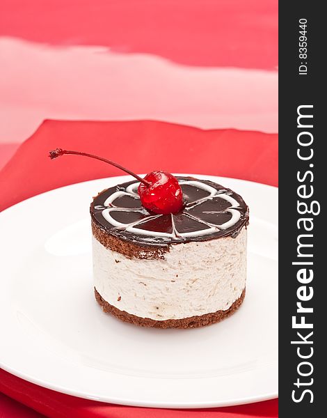 Food serie: sweet fancy cake with chocolate icing and cherry. Food serie: sweet fancy cake with chocolate icing and cherry