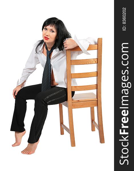 Tired brunette with necktie on chair on white