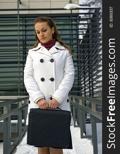 Woman from briefcase on documents. Woman from briefcase on documents