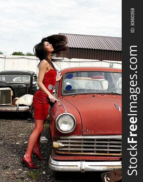 Girl beside retro car with flapping hairs. Girl beside retro car with flapping hairs