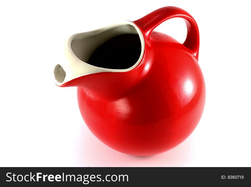 Red pitcher isolated on a white background