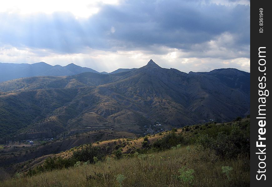 Alone mountain in sun rays