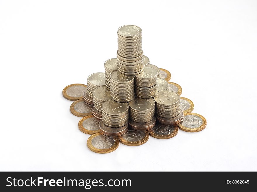 Pyramid of coins isolated on white background