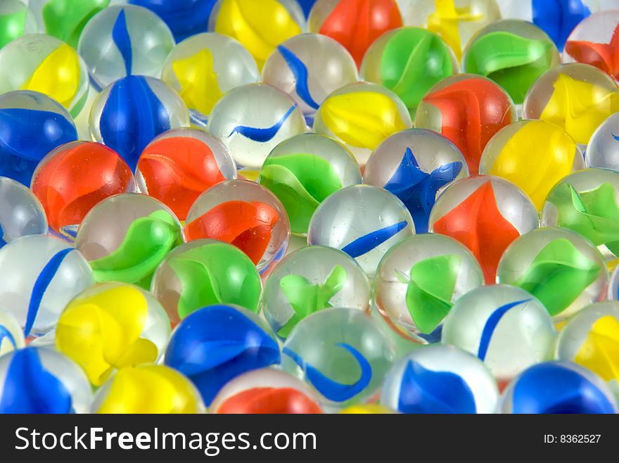 A close up of colorful glass marbles