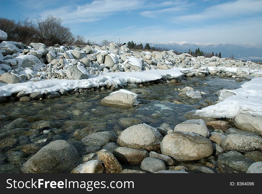 The mountain river and greater stones in water