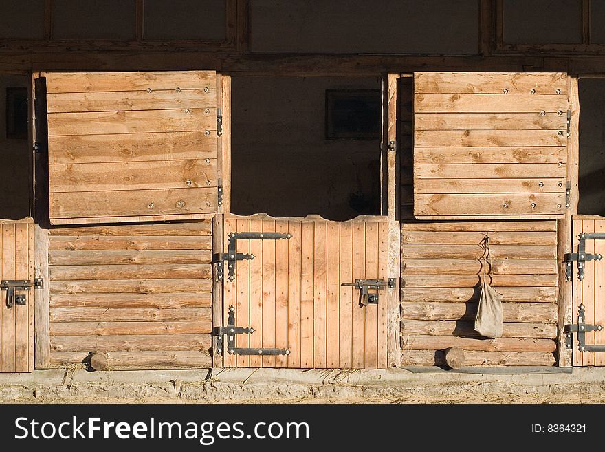 Opened outdoor wooden stable boxes. Opened outdoor wooden stable boxes