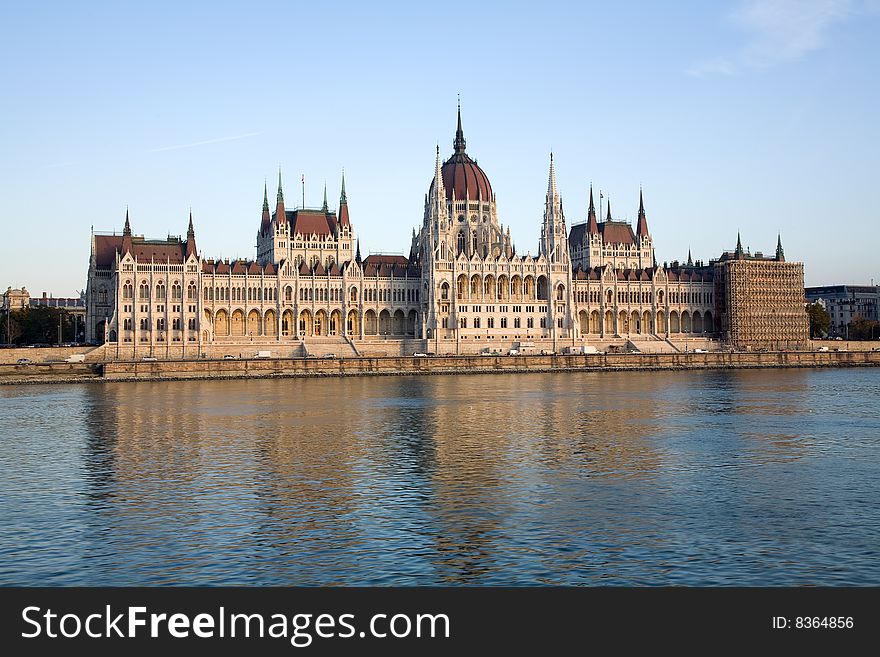 Budapest parliament building over river and blue sky. Budapest parliament building over river and blue sky