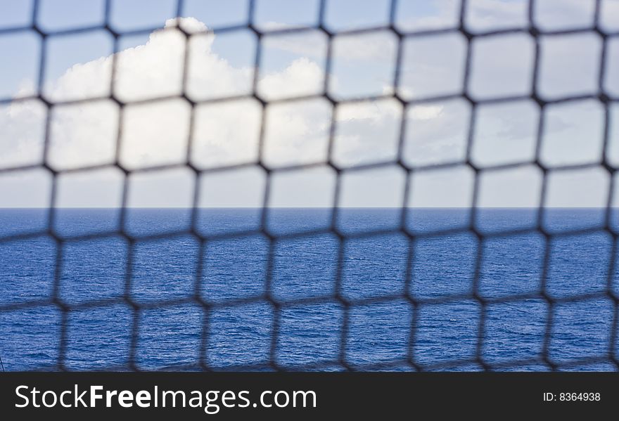 Blue Sea Beyond Rope Fence