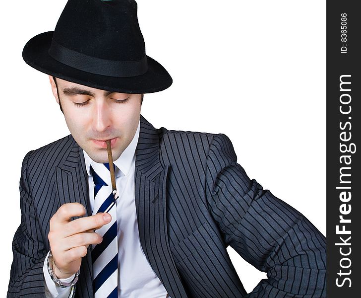 Retro businessman light a cigarette isolated over white with clipping path