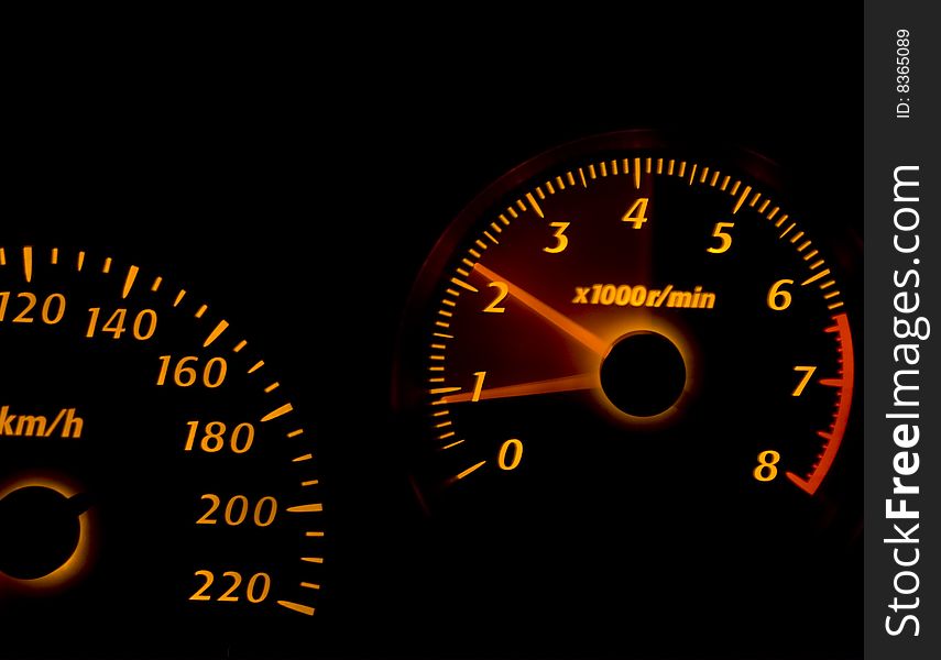 Car dashboard gauges illuminated at night, tachometer, speedometer