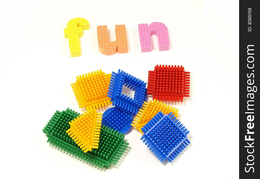 Colorful blocks and foam letters on isolated background. Colorful blocks and foam letters on isolated background.