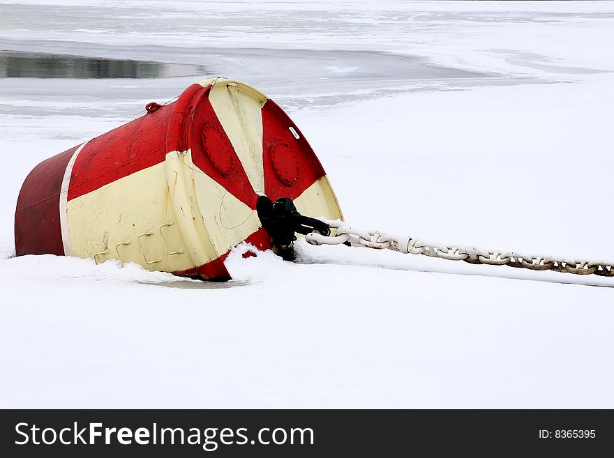 Floating onchor in the ice with chain. Floating onchor in the ice with chain