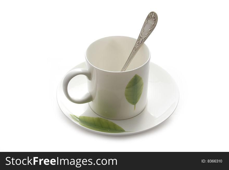 White coffee cup with green leaf