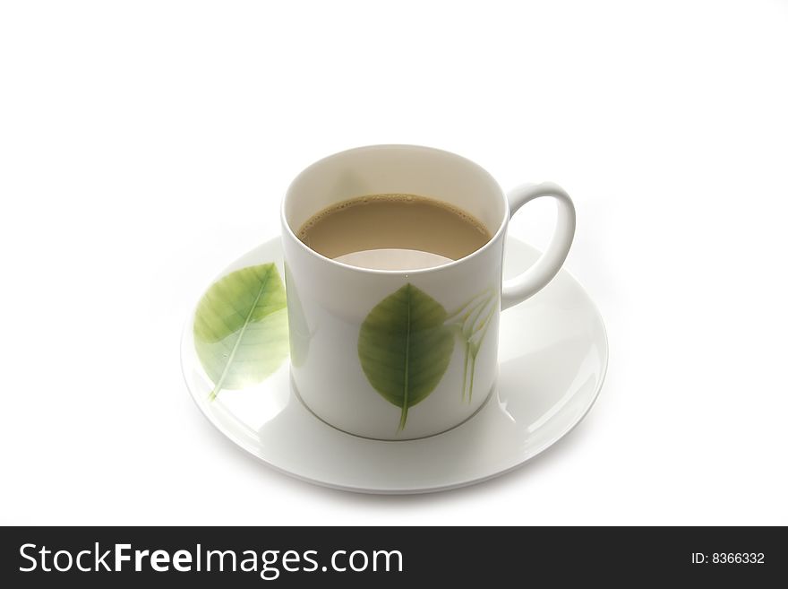White coffee cup with green leaf
