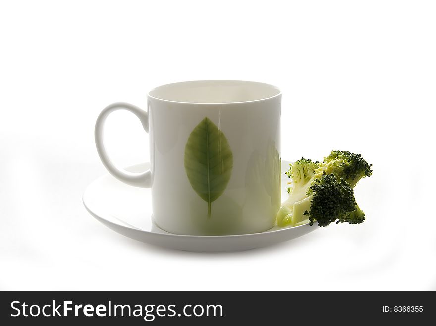 White coffee cup with green leaf