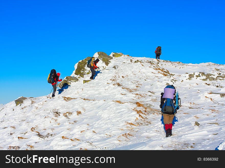 Hiker are in winter in mountains