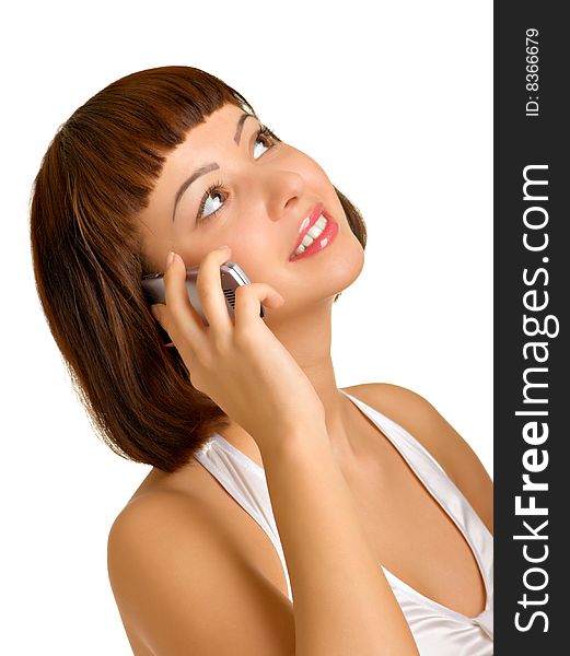 Very attractive brunette talking on a cellular phone. Very attractive brunette talking on a cellular phone