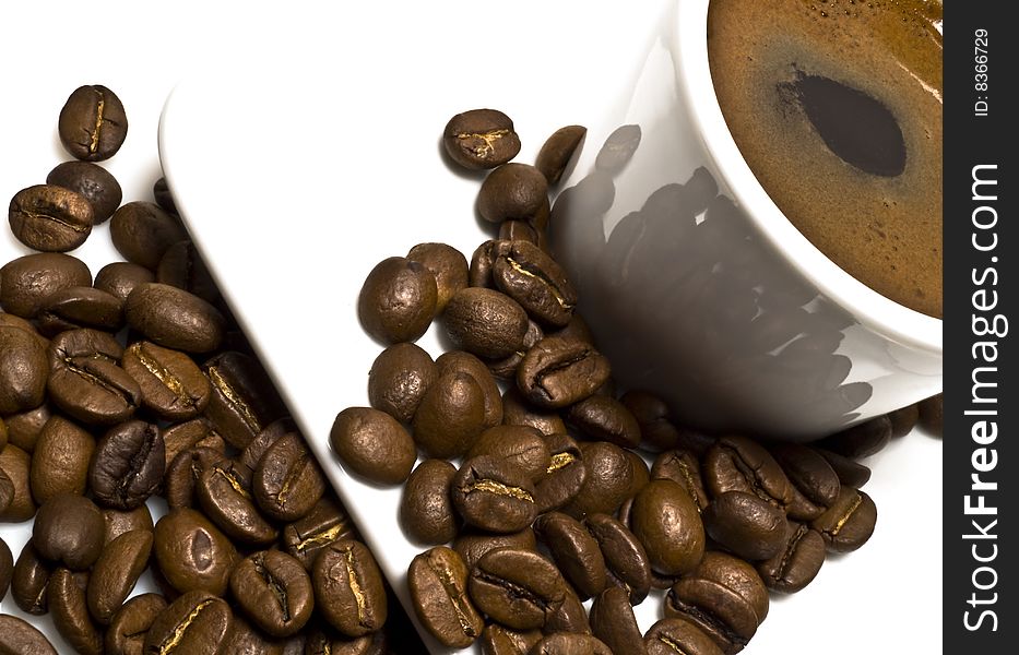 Cup of coffee with coffee grain on a white background