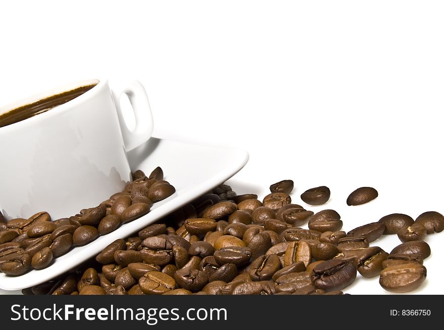 Cup of coffee with coffee grain on a white background