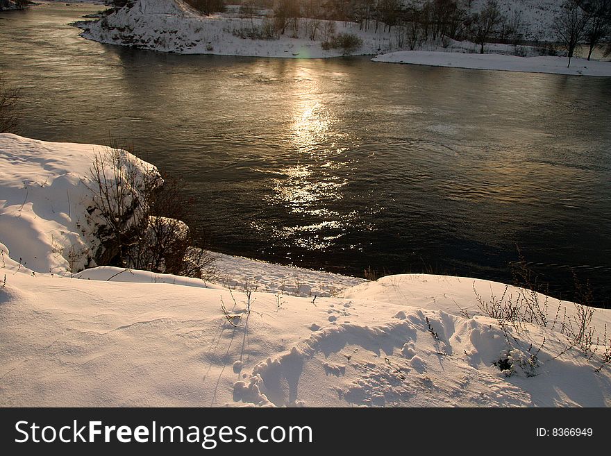 Beautiful winter landscape on the bank of the river