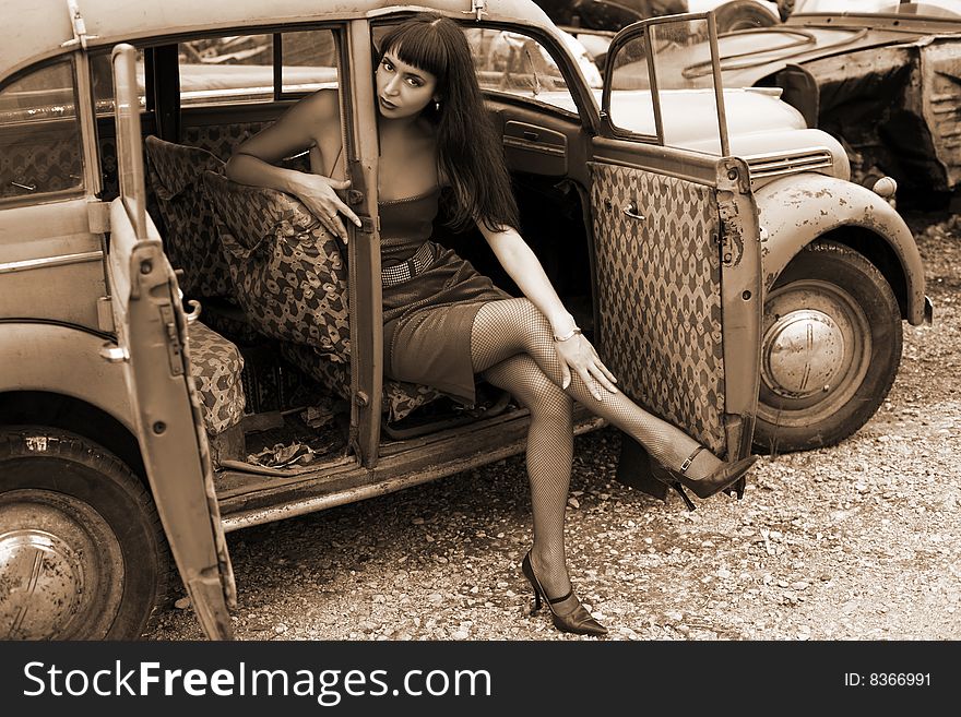 Lovely brunette in old car. Lovely brunette in old car