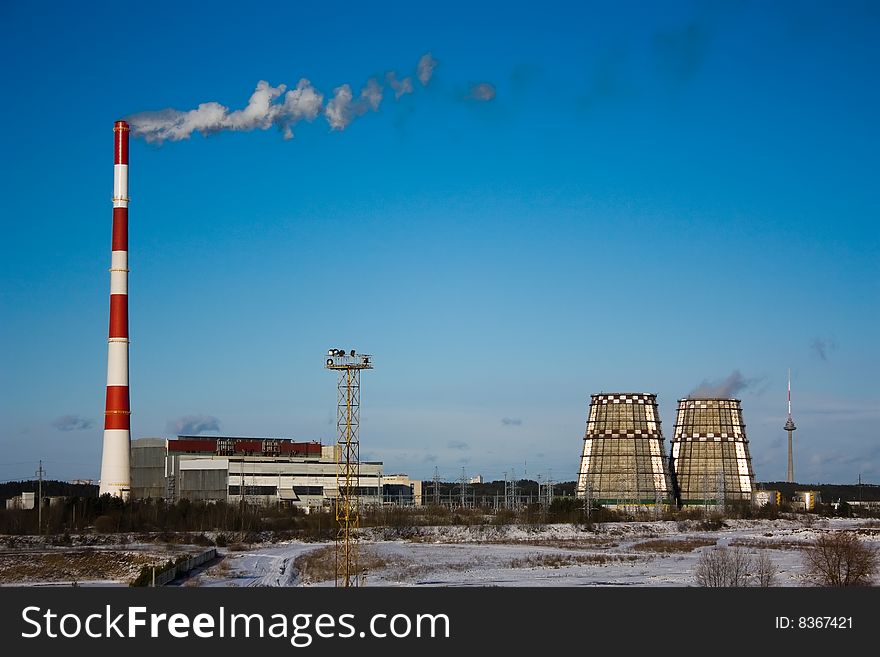 Smoke pipe against the backdrop of blue sky