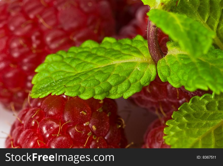 Fresh ripe rasberry and fresh mint leaves close-up. Fresh ripe rasberry and fresh mint leaves close-up