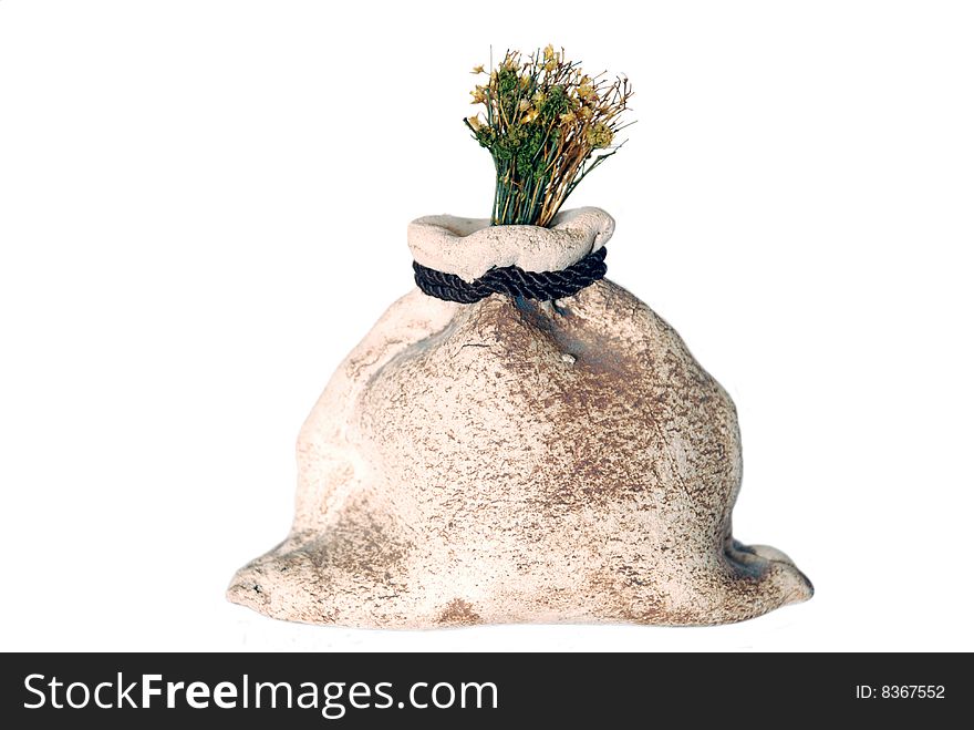 Stone bag with a dry up plant. Stone bag with a dry up plant