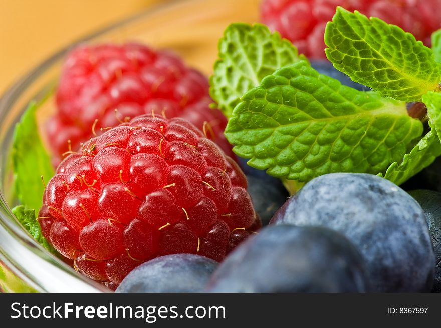 Blueberry, ruspberry and mint leaves