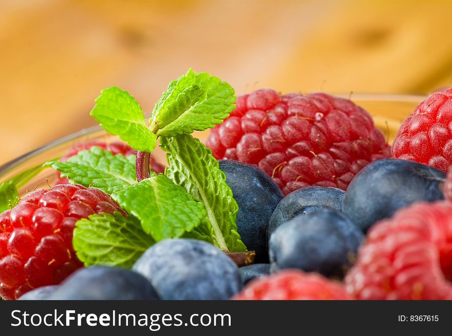 Blueberry, ruspberry and mint leaves