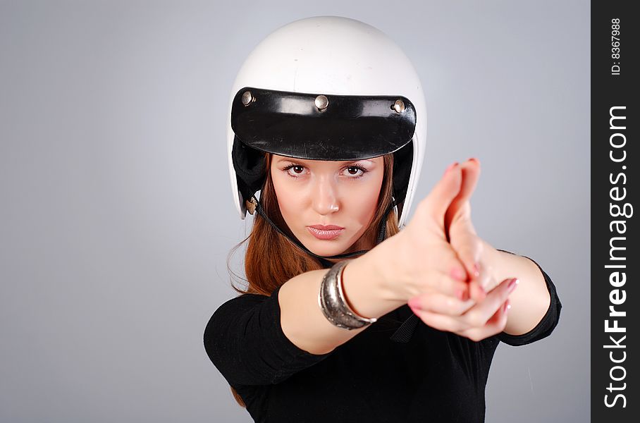 Young beautiful woman in black clothes and white helmet. Young beautiful woman in black clothes and white helmet