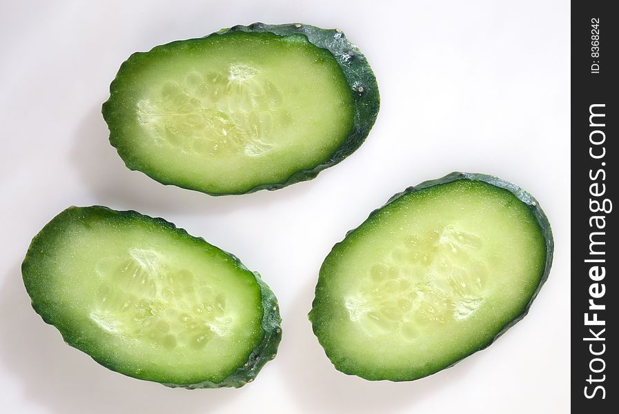 Slices of cucumber on a white background