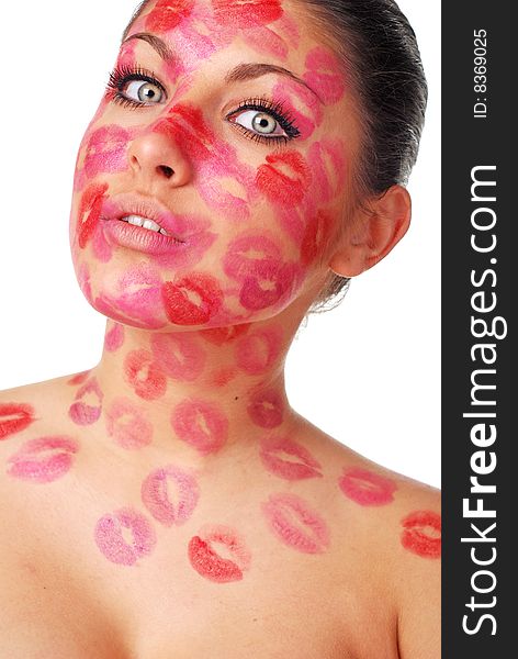 Beautiful woman with stamps of red  lipstick on her face