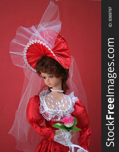 Graceful look of a doll in red bridal outfit. Graceful look of a doll in red bridal outfit