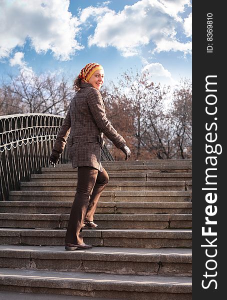 Beauty girl on stone ladder, sunny day