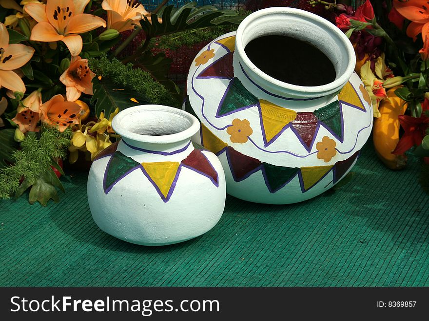 Geometrical design drawn on earthen pots painted white. Geometrical design drawn on earthen pots painted white