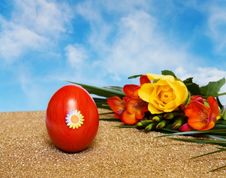 Easter Red Decorated Egg And Flowers Over Blue Sky Royalty Free Stock Photo