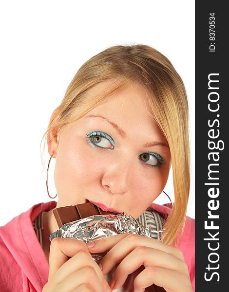 Young girl eats chocolate on white background. Young girl eats chocolate on white background