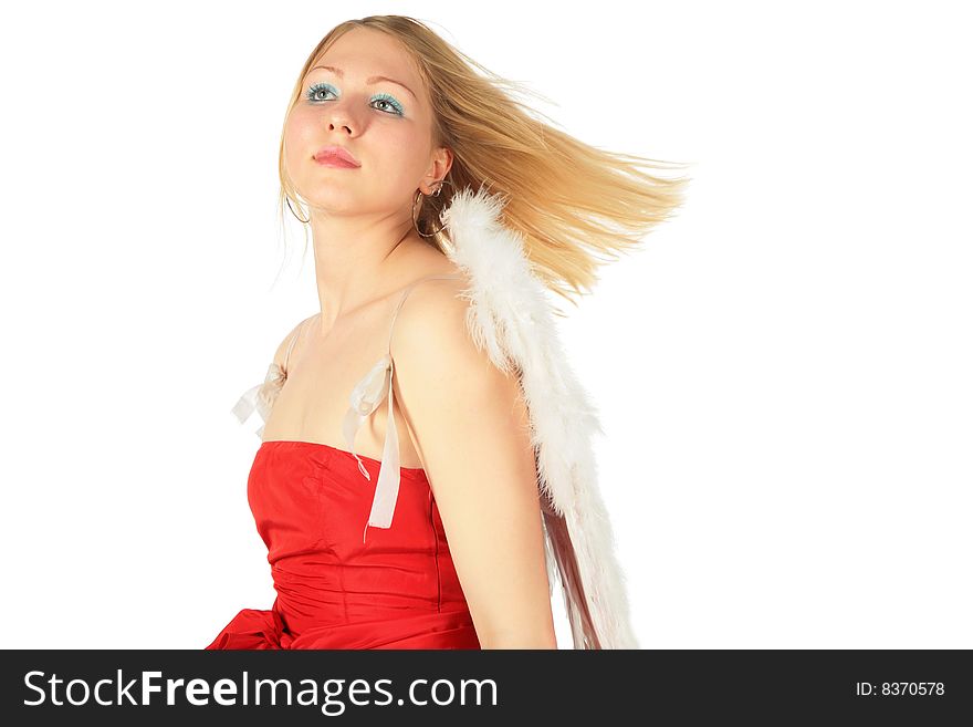 Blonde girl in red dress and angel's wings on white background