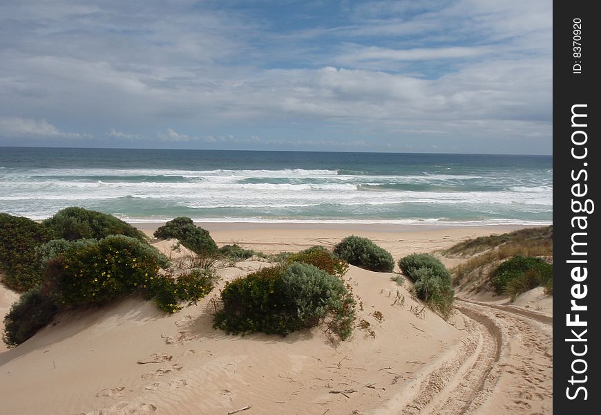 Four Wheel Drive tracks onto the beach. Four Wheel Drive tracks onto the beach